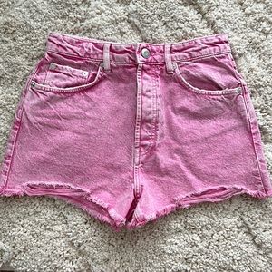 Zara pink denim shorts with distressed frayed ends.